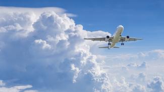 airplane flying through the clouds